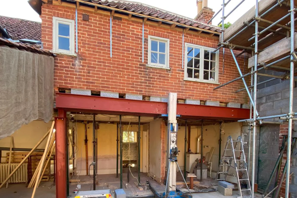 HMO conversion under construction with steel supports, scaffolding and internal structural work by Image Home Improvements